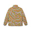 The Cosmic Drift Puffer is a colorful festival jacket featuring a wavy, abstract pattern in green, orange, pink, and blue on a light background, adorned with small white dots. This psychedelic puffer jacket is displayed from the back against a white backdrop.