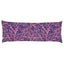 a long, rectangular purple pillow with a vibrant, abstract floral pattern in shades of purple, pink, and gold.