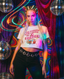 A woman with braided hair stands in front of vibrant, psychedelic curtains and sparkling disco balls, wearing The Bender Crop—a festival tee emblazoned with “GET IN LOSER WE’RE GOING ON A BENDER”—paired with a circular-link belt. Multicolored light streaks fill the scene, capturing the ultimate music festival outfit vibe.