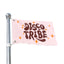 A vibrant pink Disco Tribe Flag, featuring the words DISCO TRIBE in bold retro brown letters and surrounded by orange and yellow star shapes, is mounted on a silver flagpole—making it the perfect colorful festival totem.