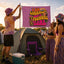 Three people at a campsite set up the “I am Literally Just a Festival Girl Flag | Electric Forest Totem | Festival Campsite Decor,” displaying its bold purple design. A tent, cooler, and camping chair are visible, while the group wears colorful festival outfits.