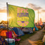 A Festival Flag from the Boho Camp Flag collection, featuring “EPIC PLAYLIST SOCIETY” in colorful letters, flutters at a campsite surrounded by tents and festival chairs at sunset, adding vibrant Music Festival Campsite Decor as a stylish festival totem.